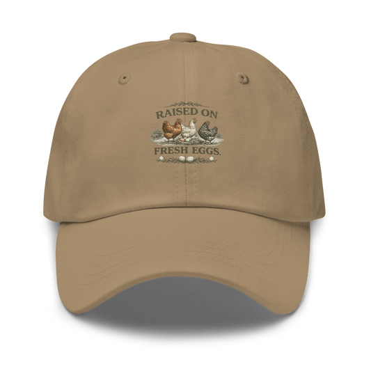 Premium Raised on Fresh Eggs™ hat for homesteaders, chicken keepers, and rural lifestyle enthusiasts. Farmhouse-inspired embroidered headwear built for life close to home.